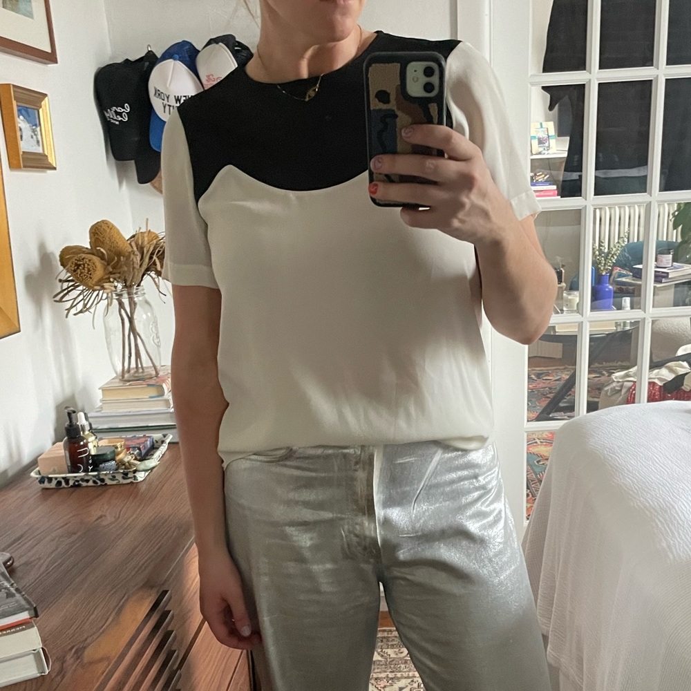 Tibi white blouse with mesh front and back.